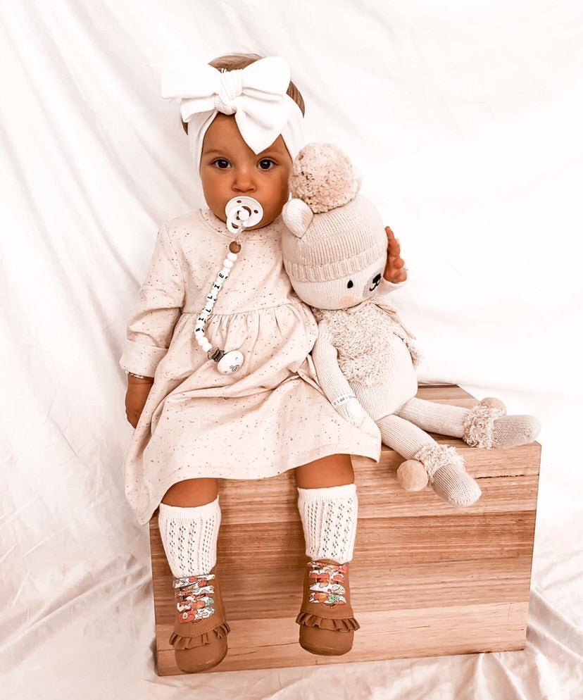 Baby tan leather boots with pink shoelaces